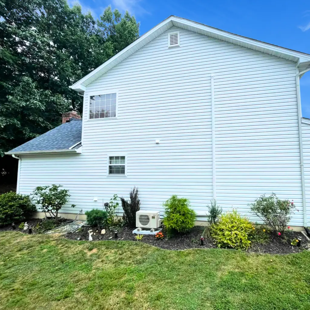 Newly installed vinyl siding on a two-story residential home.