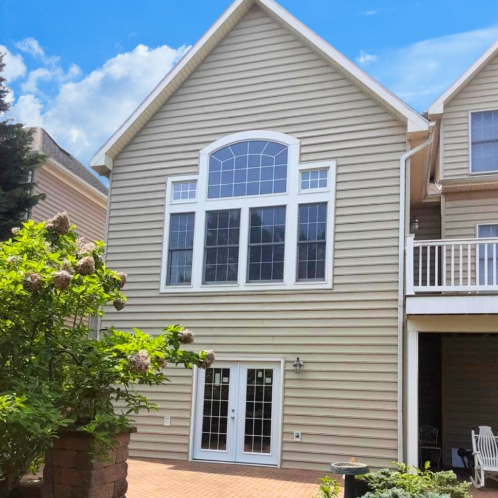 Two-story home with a newly installed vinyl siding.