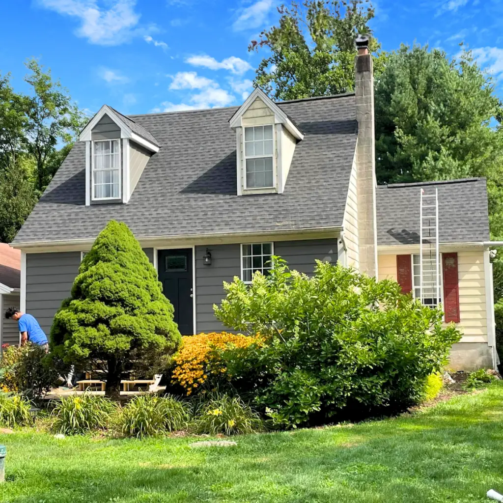 A home with a newly installed asphalt shingle roof.